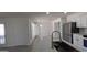 Modern kitchen showcasing white cabinets, an island sink, and stainless steel appliances at 1044 N Arvada N --, Mesa, AZ 85205