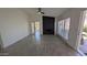 Bright living room featuring tile floors, a black fireplace and modern ceiling fan at 1044 N Arvada N --, Mesa, AZ 85205