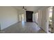Bright living room featuring tile floors, a black fireplace and modern ceiling fan at 1044 N Arvada N --, Mesa, AZ 85205