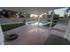 Relaxing covered patio overlooking a sparkling pool, artificial turf, and beautifully landscaped backyard at 1044 N Arvada N --, Mesa, AZ 85205