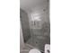 Glass shower with stone tiling and floors at 1044 N Arvada N --, Mesa, AZ 85205