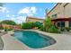 Spacious backyard with pool, lounge chairs, and covered patio perfect for relaxation at 1073 N Layman St, Gilbert, AZ 85233
