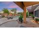 Inviting backyard and patio with outdoor dining area and lush landscaping at 1073 N Layman St, Gilbert, AZ 85233