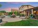 Resort-style backyard with lush landscaping, pool, outdoor dining, and charming patio space at 1073 N Layman St, Gilbert, AZ 85233