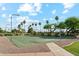 Community park featuring basketball court with lush landscaping and walking paths at 1073 N Layman St, Gilbert, AZ 85233