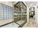 Modern bathroom showcasing a large shower with glass enclosure, dual shower heads, and updated fixtures at 1073 N Layman St, Gilbert, AZ 85233