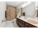 Cozy bathroom features a shower, vanity with drawers and an extra wide mirror at 1073 N Layman St, Gilbert, AZ 85233