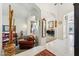 Bright foyer with white tile, arched doorways, and a view to a formal living area at 1073 N Layman St, Gilbert, AZ 85233