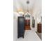 Bright foyer with tall ceilings, tile floors, and dark wood double doors at 1073 N Layman St, Gilbert, AZ 85233