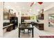 A spacious kitchen with modern appliances, a dining table, and dark wood cabinets at 1073 N Layman St, Gilbert, AZ 85233