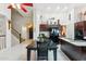 Bright kitchen featuring a dark table, black appliances, and white tiled floors at 1073 N Layman St, Gilbert, AZ 85233