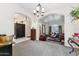 Spacious main living space with multiple living rooms featuring leather furniture and ample natural light at 1073 N Layman St, Gilbert, AZ 85233