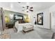 Spacious main bedroom with a ceiling fan, carpet, and a king size bed at 1073 N Layman St, Gilbert, AZ 85233