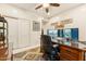 Well-lit office with dual monitors, a rolling chair, and decorative wall art at 1073 N Layman St, Gilbert, AZ 85233