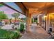 Covered outdoor living space with brick flooring offers an exceptional space to relax with a backyard view at 1073 N Layman St, Gilbert, AZ 85233