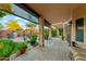 Covered patio with comfortable seating, outdoor kitchen, and scenic backyard views at 1073 N Layman St, Gilbert, AZ 85233
