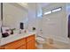Bathroom with tub and shower combo, window and neutral toned vanity at 1114 S 220Th Ave, Buckeye, AZ 85326