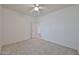Neutral bedroom featuring neutral carpet and a doorway at 1114 S 220Th Ave, Buckeye, AZ 85326