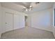 Bedroom featuring neutral carpet and a closet at 1114 S 220Th Ave, Buckeye, AZ 85326