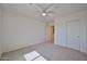 Bedroom featuring neutral carpet and a closet at 1114 S 220Th Ave, Buckeye, AZ 85326