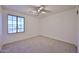 Bedroom featuring neutral carpet and a window at 1114 S 220Th Ave, Buckeye, AZ 85326