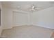 A large bedroom featuring neutral carpet and recessed lighting at 1114 S 220Th Ave, Buckeye, AZ 85326