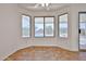 A tile-floored nook surrounded by windows featuring a pool view at 1114 S 220Th Ave, Buckeye, AZ 85326