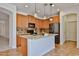A kitchen with wood cabinets, granite counters, and stainless steel appliances at 1114 S 220Th Ave, Buckeye, AZ 85326