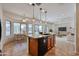 An expansive open kitchen, dining, and living area with tile floors and updated finishes at 1114 S 220Th Ave, Buckeye, AZ 85326