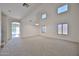 Open-concept living room boasting vaulted ceilings and multiple large windows for natural light at 1114 S 220Th Ave, Buckeye, AZ 85326