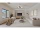 Inviting living room showcasing large windows, a ceiling fan, and comfortable seating at 1114 S 220Th Ave, Buckeye, AZ 85326