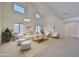 Bright and airy living room featuring vaulted ceilings, neutral tones, and modern furniture at 1114 S 220Th Ave, Buckeye, AZ 85326