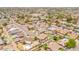 An encompassing aerial view of a neighborhood, showcasing a mix of homes, green spaces, and a tranquil suburban setting at 1186 E Brenda Dr, Casa Grande, AZ 85122