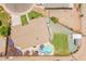 Aerial view of a home highlighting a pool, playground, well-maintained lawn, and inviting outdoor spaces at 1186 E Brenda Dr, Casa Grande, AZ 85122