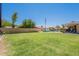 Lush backyard featuring a well-maintained lawn and inviting patio area, ideal for outdoor gatherings and relaxation at 1186 E Brenda Dr, Casa Grande, AZ 85122