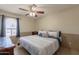 Bedroom with a queen bed, ceiling fan and large window provides natural light at 1186 E Brenda Dr, Casa Grande, AZ 85122