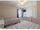 Bedroom features two beds, a ceiling fan and a large window that provides natural light at 1186 E Brenda Dr, Casa Grande, AZ 85122