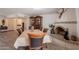 A dining room features a fireplace, decorative china cabinet, and dining table with seating at 1186 E Brenda Dr, Casa Grande, AZ 85122
