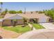 Charming single-story home featuring a well-manicured lawn and two-car garage at 1186 E Brenda Dr, Casa Grande, AZ 85122