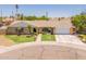 Inviting single-story home with a green lawn and a convenient two-car garage at 1186 E Brenda Dr, Casa Grande, AZ 85122