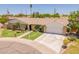 Single-story home with a tidy front lawn, desert landscaping, and a two-car garage at 1186 E Brenda Dr, Casa Grande, AZ 85122
