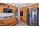 Bright kitchen features wood cabinets, stainless steel appliances, and modern fixtures at 1186 E Brenda Dr, Casa Grande, AZ 85122