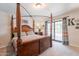Bedroom with a canopy bed, carpet flooring, and sliding doors to the pool at 1186 E Brenda Dr, Casa Grande, AZ 85122