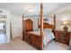 Bedroom with carpet flooring, canopy bed, and view of a doorway leading to another room at 1186 E Brenda Dr, Casa Grande, AZ 85122