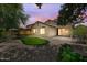 This backyard features an artificial putting green, enhancing the outdoor recreational space and overall charm at 12775 W Lowden Rd, Peoria, AZ 85383