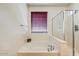 This bathroom includes a separate tub and shower combination at 12775 W Lowden Rd, Peoria, AZ 85383