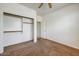 Bedroom with carpeted floor, ceiling fan, and closet at 12775 W Lowden Rd, Peoria, AZ 85383