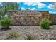 Stone Ridge community entrance with natural stone signage and desert landscaping, providing a welcoming arrival at 12775 W Lowden Rd, Peoria, AZ 85383