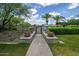Inviting community entrance with manicured landscaping, planters, and trees creating a welcoming atmosphere at 12775 W Lowden Rd, Peoria, AZ 85383