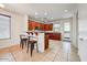 Kitchen with breakfast bar, tile floor, dark wood cabinets, and stainless steel appliances at 12775 W Lowden Rd, Peoria, AZ 85383